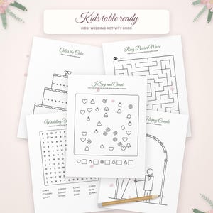 May include: A kids' wedding activity book titled Kids table ready, featuring multiple white pages with black line art. Activities include a cake coloring page, a ring bearer maze, an I Spy and Count game, a word search, and a happy couple drawing.
