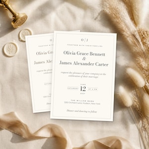 May include: A white wedding invitation card featuring the text O J, Together with their families, Olivia Grace Bennett and James Alexander Carter request the pleasure of your company at the celebration of their marriage, Saturday June 12 2027 at 4 PM.