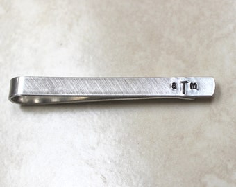 Monogram tie bar in aluminum or nugold available in 3 lengths