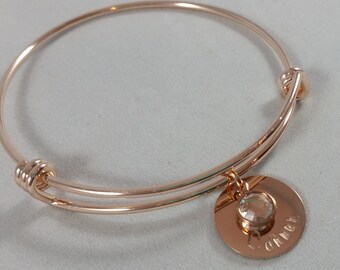 Rose gold bangle personalized with childrens names and birthstones