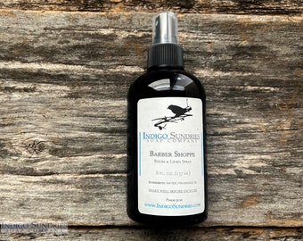 Salón de barbería y spray para ropa