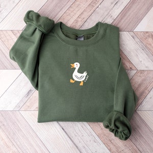 Lucky Ducky Graphic Sweatshirt: Retro Unisex Rundhalsausschnitt