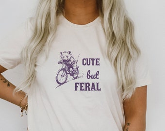 Cute But Feral Little Possum on A Bike Funny Cute Sarcastic Shirts Vintage Animal Sayings Ultra Soft Graphic Tee Unisex Soft T-shirt