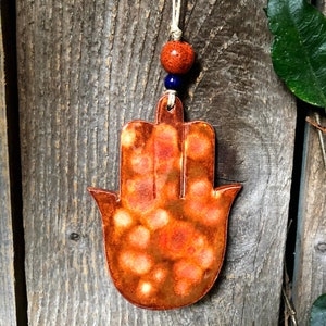 handmade hamsa hand art, ceramic khamsa wall hanging, hamsa protection, orange hamsa, hamsa ceramic charm, rear view mirror hanging khamsa