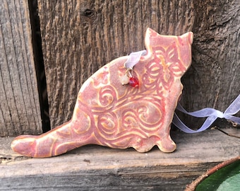 handcrafted ceramic cat ornament, delicate floral texture, suspended from white ribbon, elegant beads, cat lovers gift, ideal holiday decor