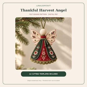 May include: A felt angel ornament sewing pattern titled Thankful Harvest Angel. The design features a cream-colored head, cream wings with red and green embroidery, and a red and dark green dress with floral stitching and a scalloped hem.