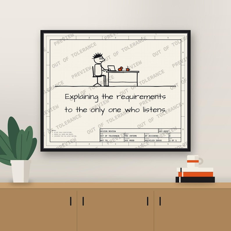 Framed printable poster on an office wall: Explaining the requirements to the only one who listens.