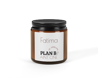 May include: A brown glass candle jar with a black screw-top lid and a white label. The label features the name Fatima in thin black text, followed by the text 99 PROBLEMS BUT PLAN B AINT ONE in a mix of bold and thin black lettering.