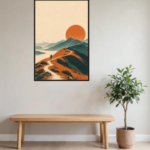 Peut inclure: Une impression d'art mural encadr&eacute;e repr&eacute;sentant une illustration de paysage avec une personne courant sur un sentier de montagne sinueux. La sc&egrave;ne comprend des montagnes bleu fonc&eacute;, un soleil orange vif et un ciel clair, le tout dans un cadre noir.