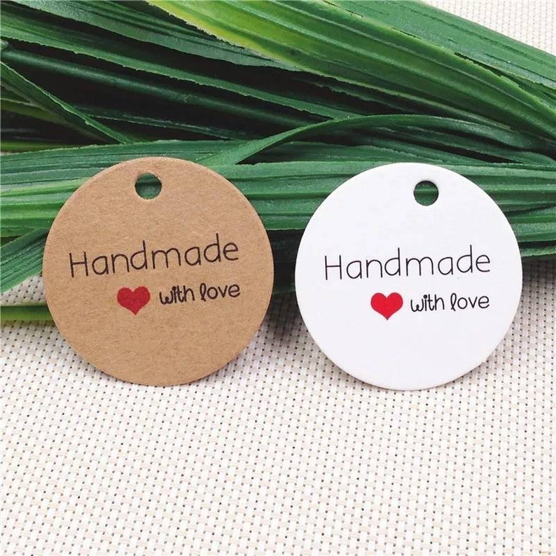 May include: Two round gift tags, one brown and one white, with the text "Handmade with love" and a red heart.