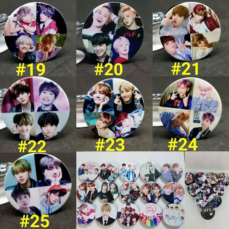 May include: A set of 25 round, colorful, printed buttons featuring images of a popular K-pop group. The buttons are numbered 19 through 25. The last button shows a group of smaller buttons with various images of the group.
