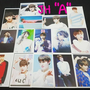 May include: A set of 12 photo cards featuring a young man in various poses. The cards are printed on white cardstock and have a glossy finish. The photos are taken in a variety of settings, including indoor and outdoor locations. The man is wearing a variety of clothing, including a white shirt, a blue shirt, a pink shirt, and a black jacket. The cards are all in good condition and have no visible damage.