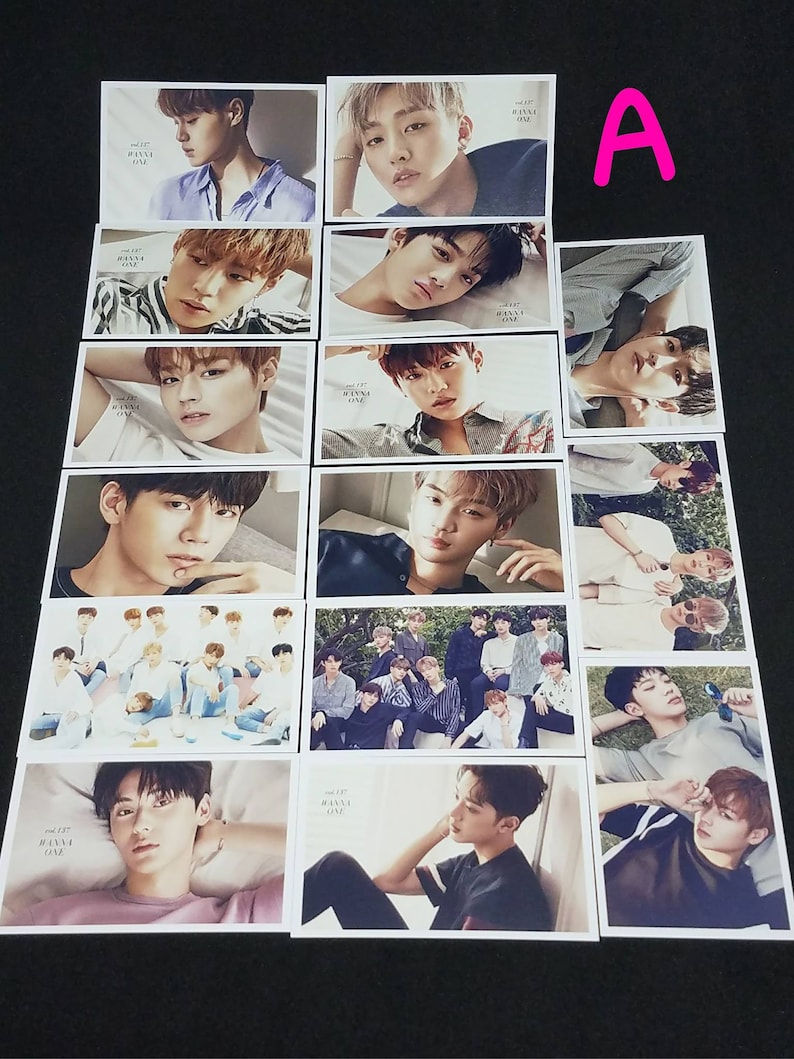 May include: A set of 12 photo cards featuring a K-pop boy band. The cards are white with black text and feature various photos of the band members. The text on the cards reads "1st Mini Album Wanna One".