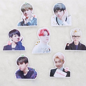 May include: Set of ten stickers featuring different members of a K-pop group. Each sticker has a white background with a colourful image of a person. The stickers feature the text "Rap Monster" and "Love you so much".