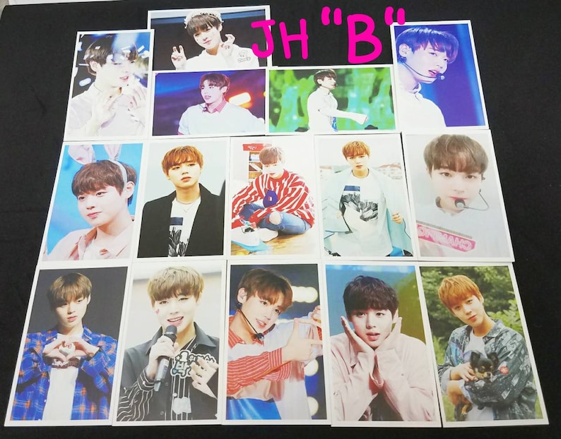 May include: A collection of 12 photo cards featuring a young man with brown hair. The cards are printed on white cardstock and feature various poses and expressions. The cards are all the same size and shape. The text "JH "B"" is written in pink letters on a white background at the top of the image.