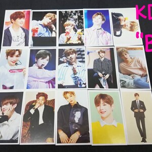 May include: A collection of 15 photo cards featuring a young man in various poses. The cards are white with a black border and feature the text "KD "B"" in the top right corner.