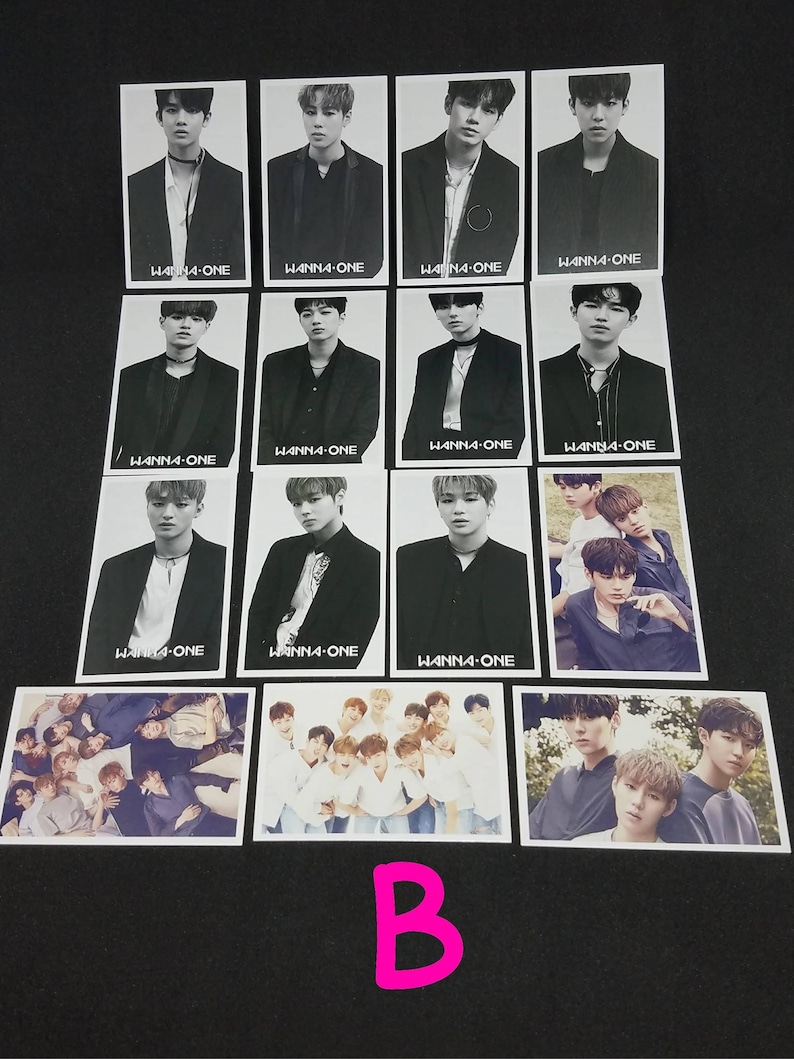 May include: A set of 12 black and white photo cards featuring a K-pop boy band. The cards feature individual band members and a group photo. The cards have the band's name "WANNA-ONE" printed on them.