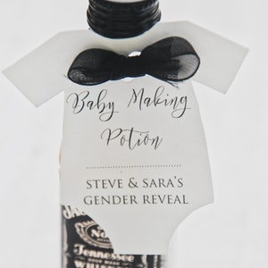 May include: A miniature bottle of liquor with a white onesie-shaped tag that says "Baby Making Potion" and "Steve & Sara's Gender Reveal".