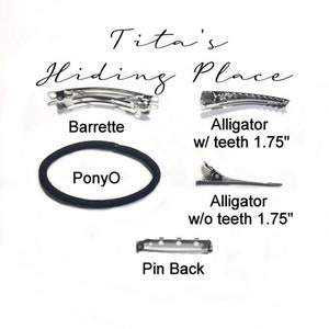 May include: A set of hair accessories including a barrette, a ponytail holder, and two alligator clips, one with teeth and one without. The alligator clips are 1.75 inches long. The text "Tita's Hiding Place" is written at the top of the image.