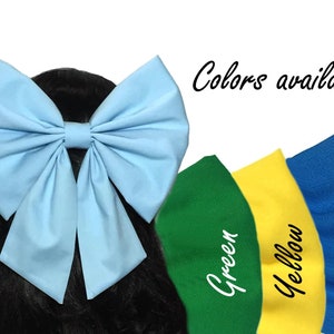 May include: A large light blue fabric bow with a centre loop. Colours available: green, yellow, blue.
