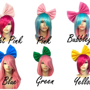 May include: Six different coloured hair bows with matching wigs. The bows are light pink, pink, bubblegum pink, blue, green, and yellow. The wigs are pink, blue, light blue, pink, pink, and pink.