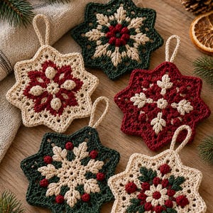 May include: Five star-shaped crochet ornaments featuring intricate snowflake patterns in cream, dark green, and deep red yarn. Each ornament includes a small matching crochet loop at the top for hanging, showcasing detailed stitching and textures.