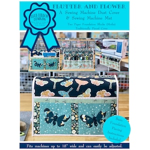 May include: A sewing machine dust cover and mat with a butterfly and flower design. The cover is made of fabric with a blue, green, and black color scheme. The mat has pockets for storing sewing supplies. The cover fits machines up to 18 inches wide.  "Flutter and Flower" and "Blue Ribbon Designs" are printed on the image.