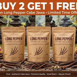 May include: Three brown paper pouches of Long Pepper Cabe Jawa, each labeled 50g. The text reads Gourmet Spices, Long Pepper, Cabe Jawa, Piper retrofractum, Indonesian Long Pepper, Natural, Handpicked, Organic. Loose peppers are scattered below.