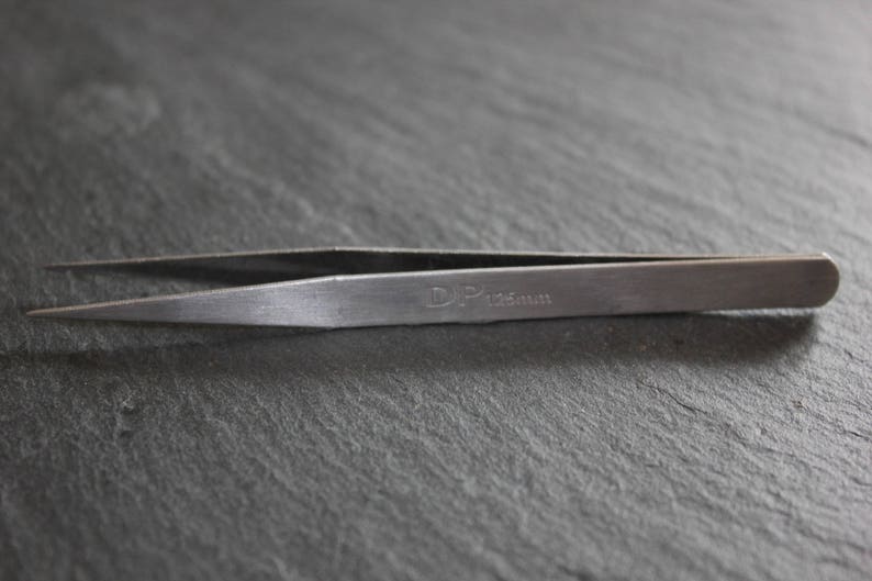 Metal clip to end right called clamp tweezers