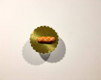 Éclair miniature glaçage orange rayé blanc en pâte polymère