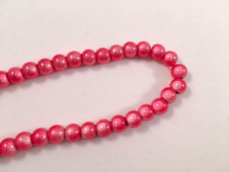 Lot de 10 perles miracle, coloris rouge corail diamètre 6 mm image 1