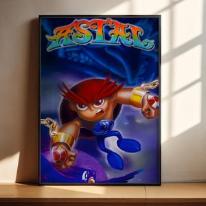 Puede incluir: Un póster enmarcado con la palabra ASTAL en letras de colores arcoíris en la parte superior. Debajo, un personaje de piel morena con cabello rojo puntiagudo lleva brazaletes dorados con gemas rojas y cadenas sobre un fondo azul oscuro.
