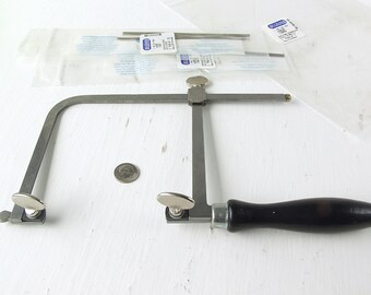 German Adjustable Jeweler's 4-3/4" Saw Frame With 46 Blades. Includes Laser Gold™ #2/0 And #1/0 Saw Blades.
