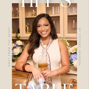 Può includere: Una persona indossa un top senza maniche color crema e un foulard fantasia, tenendo in mano un bicchiere con un liquido dorato. L'immagine presenta il testo "TIFF'S TABLE" e "HOST FROM THE HEART BY TIFFANY JOHNSON" sovrapposto.