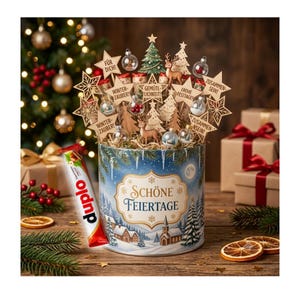 May include: A cylindrical tin container labeled Schöne Feiertage featuring a winter village scene, filled with wooden star cutouts, deer figures, and small glass ornaments. A Duplo chocolate bar rests beside the tin on a wooden surface.