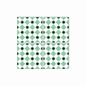 May include: Four square ceramic tiles with a repeating pattern of black stars on a light green background. The stars are set in a diamond pattern.