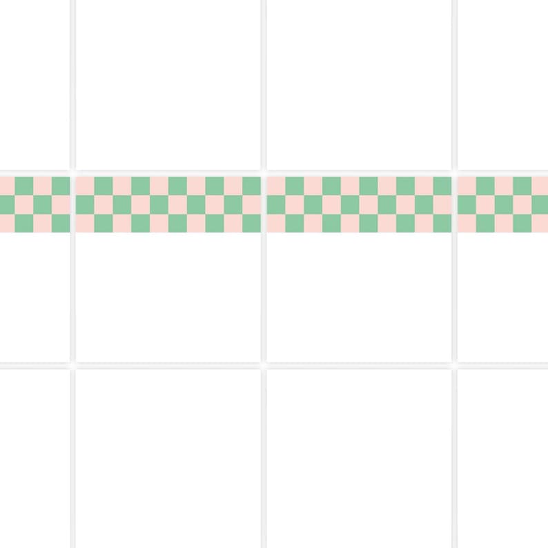 May include: A repeating pattern of alternating pink and green squares. The checkered design is centered horizontally and runs across the top of a grid of white squares. The pattern is a simple, geometric design.