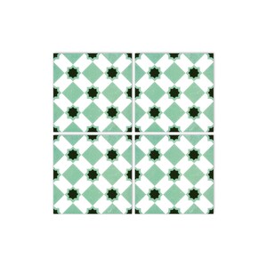 May include: Four square ceramic tiles with a repeating pattern of black stars on a white and green checkered background.