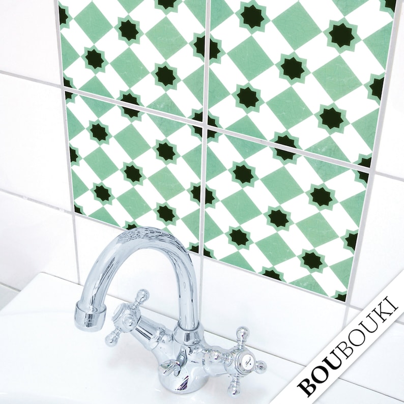 May include: Green and black patterned tile stickers for a bathroom or kitchen. The stickers are arranged in a grid pattern and feature a geometric design. The stickers are shown on a white tiled wall.