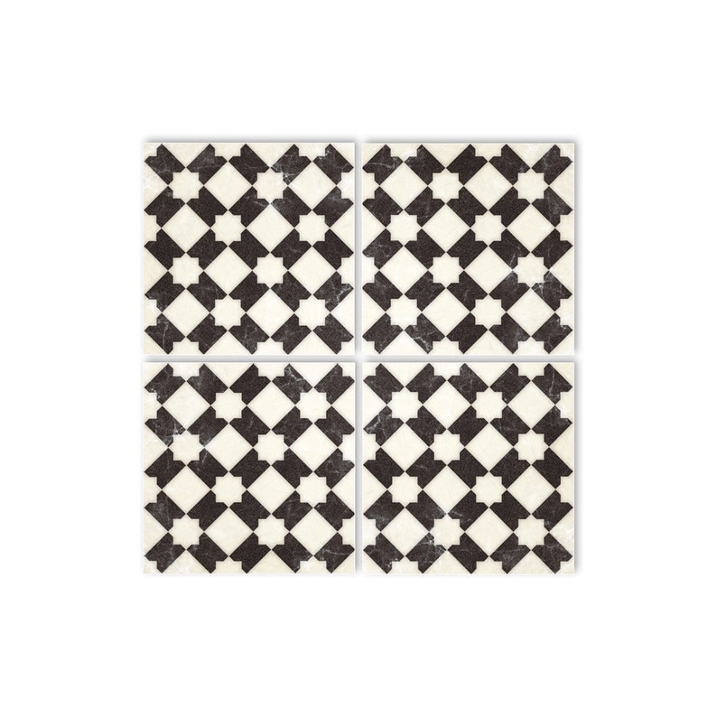 May include: Four black and white square tiles with a geometric pattern. The tiles have a distressed look, giving them a vintage feel.