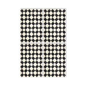 May include: Four black and white patterned square tiles with a geometric design. The tiles have a distressed, vintage look.