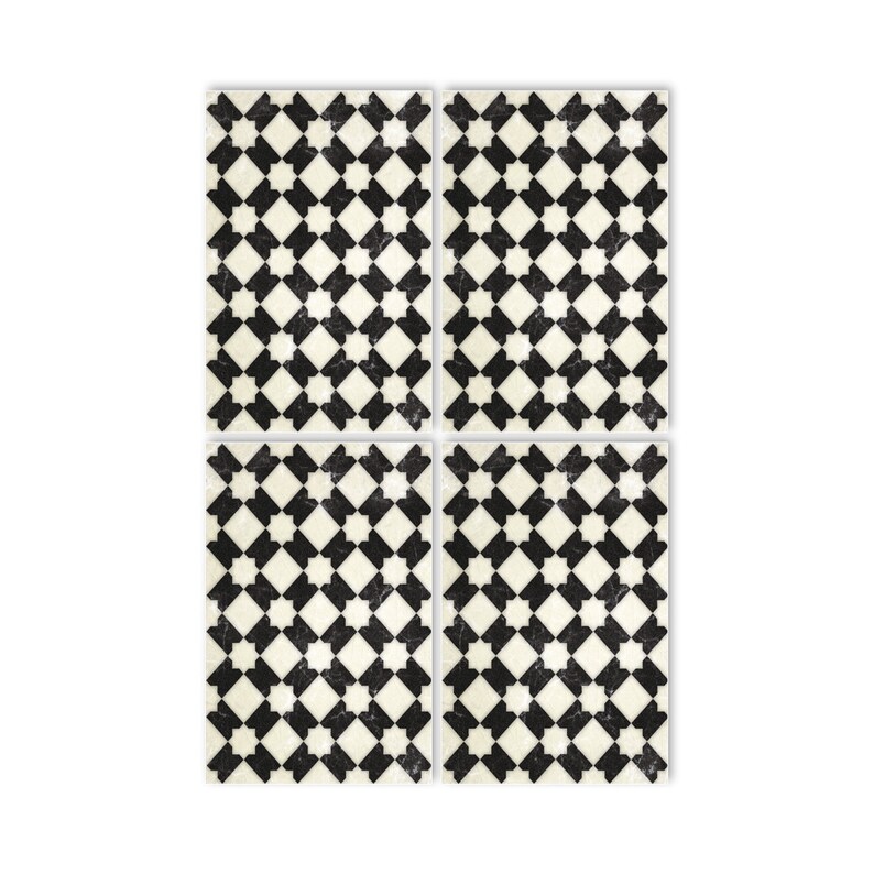 May include: Four black and white patterned square tiles with a geometric design. The tiles have a distressed, vintage look.