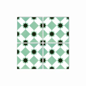 May include: Four square ceramic tiles with a repeating pattern of black stars on a white and green diamond background.