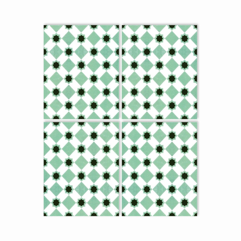 May include: Four square green and white ceramic tiles with a black starburst pattern.