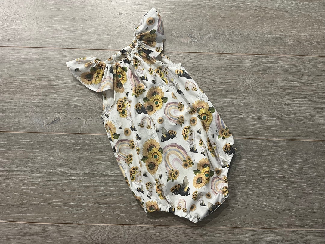 Baby Girl Sleeveless Floral Romper – Beige with Sunflower Detail