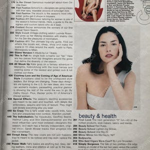 May include: A magazine cover featuring a model with long dark hair and a white tank top. The cover text reads "on the cover" and "beauty & health".
