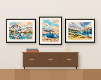 Könnte beinhalten: Ein Set aus drei gerahmten Landschaftsgemälden, die Gebirgszüge und Bergseen zeigen. Die Kunstwerke weisen lebendige Blau-, Orange- und Grüntöne mit sichtbaren Pinselstrichen auf und sind jeweils in schlichte schwarze Rahmen gefasst.