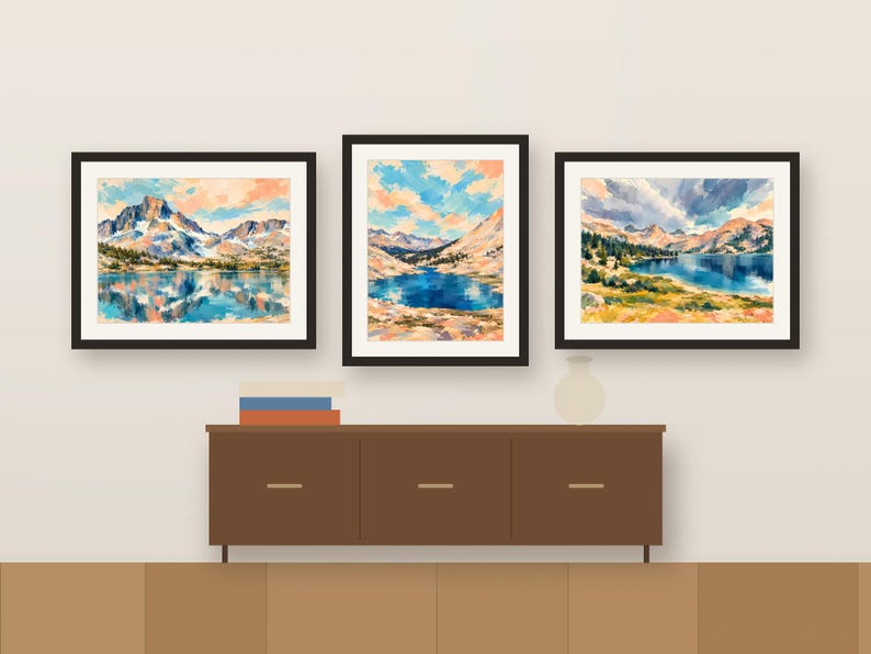Three colorful Sierra lake prints framed in a row above a wooden sideboard, shown as a room mockup