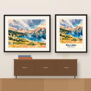 Colorful Rae Lakes artwork and its place-name poster, framed side by side above a wooden sideboard, shown as a room mockup