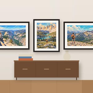 Three woman hiker prints framed in a row above a wooden sideboard, shown as a room mockup